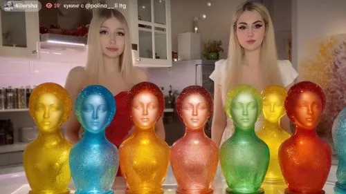 
Эта девушка  Скульптуры из цветного стекла.,a group of woman standing around colored glass heads,perfume bottles,cola bottles,jelly babies,perfume bottle,mannequins,orbiters,metronomes,lava lamp,aura