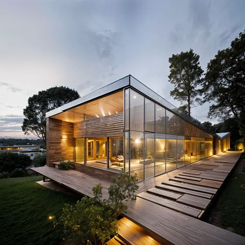 the inside and outside view of a glass cabin,modern house,timber house,modern architecture,cubic house,dunes house,dinesen