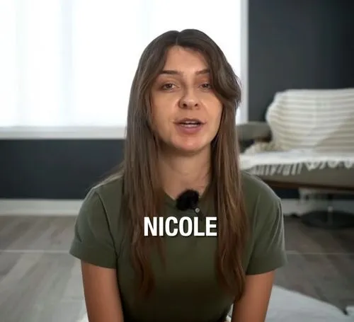 a 28 year old youtuber girl wearing ashort skirt, slender,a woman is holding a conversation bubble with a name of nicole,in a shirt,mic,real estate agent,nickel,nickle,mica,tee,girl in t-shirt,nonsexi