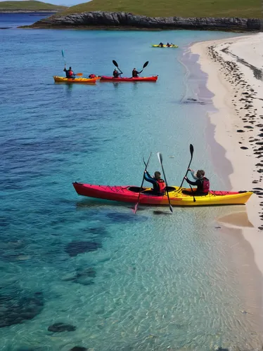 Kayakers head to the sea with their kayaks on Cambusdarach beach,,falkland islands,rottnest island,rottnest,surf kayaking,sea kayak,orkney island,galapagos islands,kayaks,cape verde island,ascension i