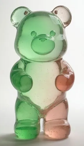 [gummi bear] figurine by glass, in the style of layered translucency, [green] and [pink], Light], 20 megapixels, transparency,a bear figurine sitting upright against a white background,gummy bear,gumm