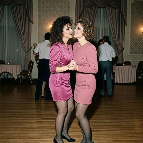 Lesbian erotica, two women of around 40 years old stand in a ballroom wearing pink colored mini-dresses and grey pantyhose, lesbian attraction, gazing at each other, leaning in for a kiss, smiles, ha
