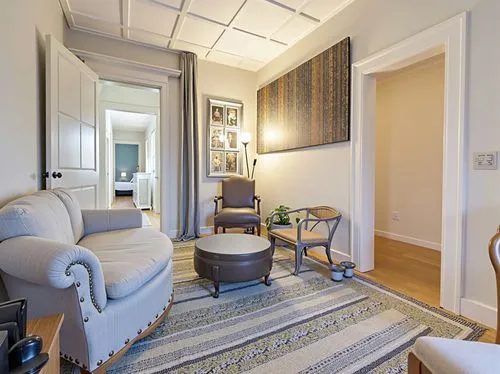 there is an old fashioned living room with a couch,casa fuster hotel,enfilade,claridge,sitting room,hallway space,appartement,gold stucco frame,venice italy gritti palace,great room,wainscoting,interi