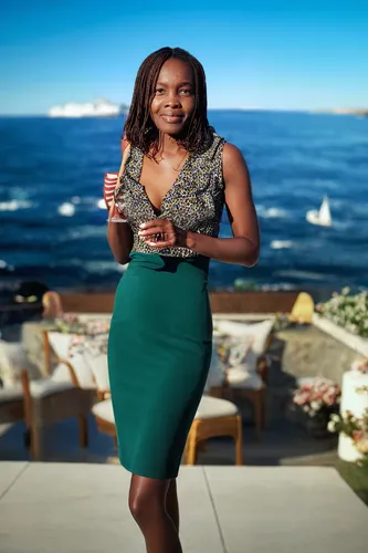 television presenter,maria bayo,cocktail dress,a glass of champagne,a bottle of champagne,african american woman,female hollywood actress,capetown,south african,african woman,south africa,beach backgr