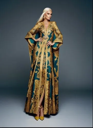 a blonde woman is dressed in a dress with blue and gold designs,caftan,kaftan,donatella,raja,aquaria,caftans,Photography,Fashion Photography,Fashion Photography 06