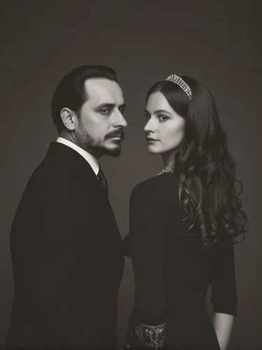 Official black and white photo double portrait of Their Majesties King Charles I and Queen Olga of Württemberg.,a man and woman dressed up in black are posing for a black and white po,vintage man and 