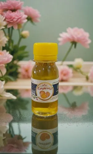 a jar of honey sits on the counter,thai honey queen orange,edible oil,flower honey,asafoetida,baobab oil,natural oil