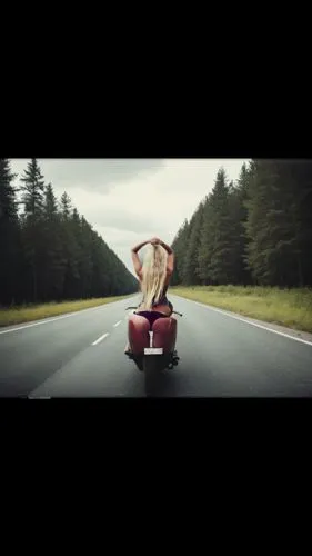 асфальтированная трасса с по обе стороны лес и поле,person riding down the road on a very nice motor scooter,joyriding,sidecars,hitchhiked,hitchhike,open road,hitchhikes