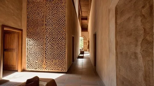 moroccan pattern,persian architecture,marrakesh,iranian architecture,riad,ornamental dividers,islamic pattern,patterned wood decoration,islamic architectural,marrakech,carved wall,stucco wall,hallway,morocco,qasr al watan,alhambra,hallway space,spanish tile,sandstone wall,wooden door,Photography,General,Realistic