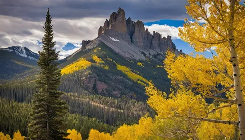 Chimney Rock, in the San Juan mountain range, stands above a grove of aspens.,castle mountain,autumn mountains,united states national park,hoodoos,yellow mountains,telluride,butte,camel peak,rocky mou