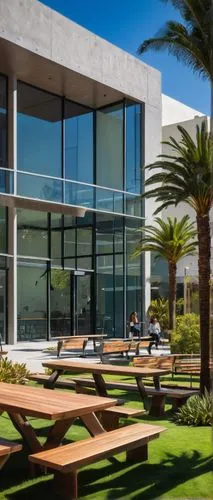 Modern design school, Los Angeles, California, USA, sunny day, blue sky, palm trees, building exterior, glass facade, steel structure, minimalist architecture, clean lines, open courtyard, wooden benc