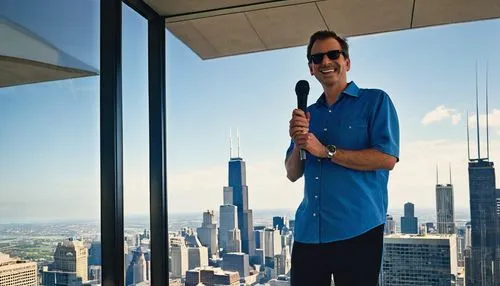 Willis Tower, Chicago, tour guide, holding microphone, smiling, sunglasses, blue shirt, dark pants, sneakers, standing in front of glass window, reflecting cityscape, sunny day, clear sky, few white c