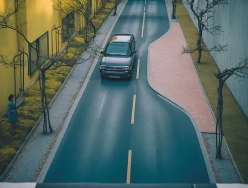 arboles verdes
calle de concreto gris 
,a truck driving down a street surrounded by tall buildings,overpass,asphalt road,city highway,overpassed,street canyon,roads,Photography,General,Cinematic