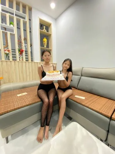 black fishnet,two young ladies sitting on a couch with a cake,water sofa,inflatable mattress,jacuzzis,chaise lounge,inflatable pool,health spa,asiaticas,seating furniture,soft furniture,thalassotherap