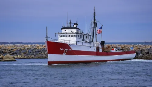 The Sally J heads out to sea from Scituate Harbor in Scituate Massachusetts on a cold February Day.,uscg seagoing buoy tender,united states coast guard cutter,fireboat,lightship,tugboat,stack of tug b