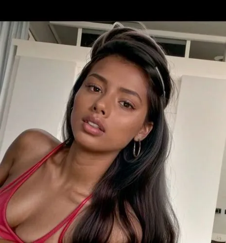 You can see her whole body.  She is lying at home on the sofa.  Lazy lying position.  She wears gray shorts and a shirt.,nahri,thahane,liliyana,filipina,angolan,uhura,filipino,panamanian,marshallese,a