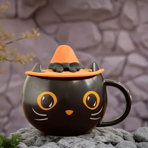 there is a cup shaped like a cat,tea cup fella,asian teapot,tea zen,cat drinking tea,teapot,tea party cat