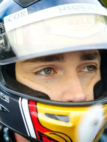 a close - up view of a motorcycle rider wearing his helmet,newgarden,charles leclerc,farfus,nemechek,max verstappen,verstappen,heidfeld,hartley,wiesenberger,jolyon,logano,hinchcliffe,kligerman,cassill