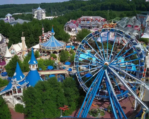 Explain why Europa Park is considered a top European amusement park.,amusement park,elves flight,annual fair,bird's-eye view,children's ride,theme park,fanuapark,popeye village,overhead view,bird's ey