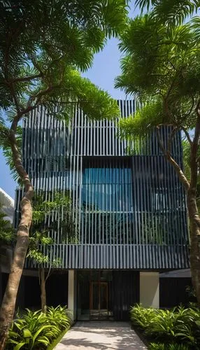 Modern Amar Architecture and Design Pvt Ltd office building, Chennai, India, contemporary glass facade, sleek steel frames, angular roofline, minimalist entrance, abstract sculptures, lush greenery su