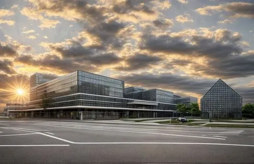 hospital, trees, people, morning sun vehicles and bikes in foreground, cars on the street, children,mercedes-benz museum,new city hall,office buildings,office building,corporate headquarters,biotechno