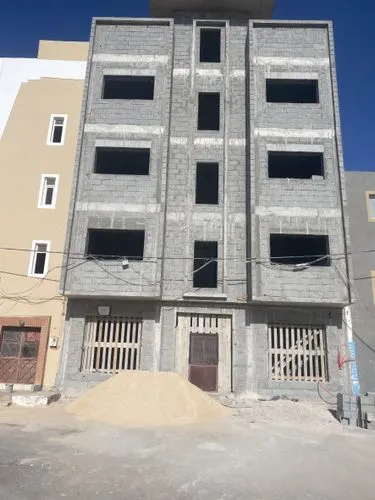 two large buildings are all next to each other,khayelitsha,hospicio,luderitz,sohag,residencial,hargeisa,langfang,muharraq,qalandia,mogadishu,gafsa,oujda,mekelle,khurmatu,habitaciones,comodoro,hadramut