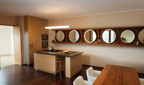 round mirrors and shelves on the wall,a modern kitchen with a bar and four round mirrors,habitaciones,kitchenette,appartement,smartsuite,kitchen design,kitchen interior,modern kitchen interior,contemp