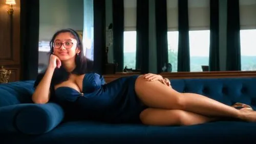 she has old blue dress from the 1940s with a big skirt and she is laying down in a couch in a very sexy and seductive way and she has a huge boobs and she is covered in sperm,jyothika,soundarya,sonaks