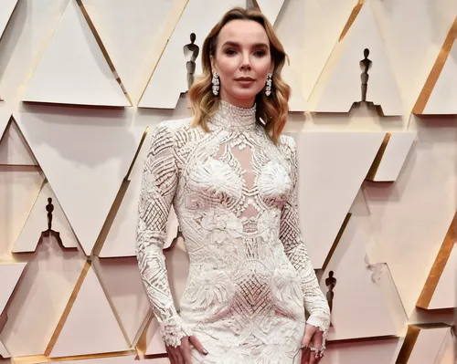 Killing Eve's Jodie Comer looked sensational in a white custom Tom Ford gown with long sleeves,oscars,white winter dress,queen cage,white velvet,female hollywood actress,white with purple,white lady,w