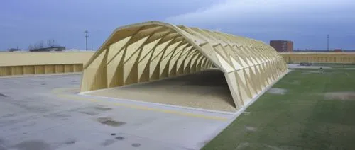 a sculpture that is in the middle of an empty field,auditorio,acconci,bandshell,folding roof,guastavino,roof structures