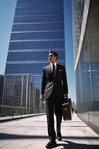 Modern skyscraper, sleek glass facade, metallic frame, sharp edges, urban cityscape, busy street, concrete jungle, daytime, clear blue sky, few white clouds, 3/4 composition, shallow depth of field, a