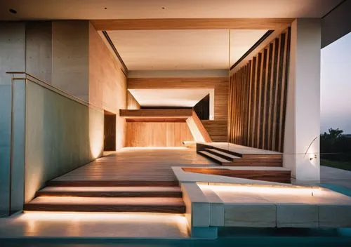 glass woodpanelling office black steel windows tiles  light sunlight blue night view Spotlights warm wooden floor plants,the hallway leading up and down to a house with wooden stairs,amanresorts,corte