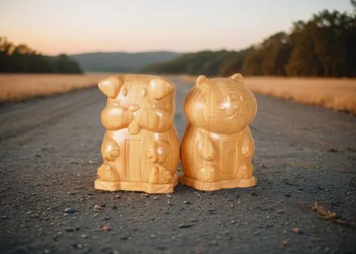 the pair of wooden animals are waiting on the roadside for their owner,cambyses,easter rabbits,wooden figures,hare trail,rabbits,hares,Small Objects,Outdoor,Sunrise