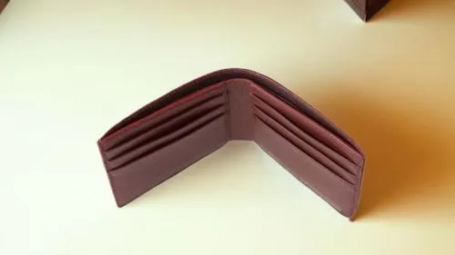 a wallet opened on top of a table,toblerone,mitres,callebaut,swiss chocolate,ganache,embossed rosewood