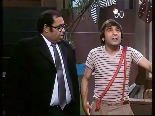 two men are talking on a set of a s888how,ranjeet,brahmanandam,mehmood,feluda,chaves,ashour