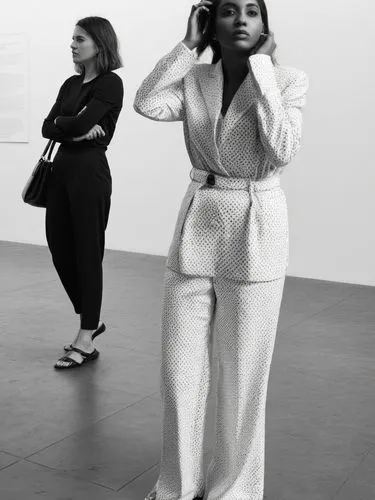 Two different women.,two women are standing in the middle of the floor,tate modern,moma,zwirner,lacma,woman in menswear,sfmoma,Photography,Black and white photography,Black and White Photography 01