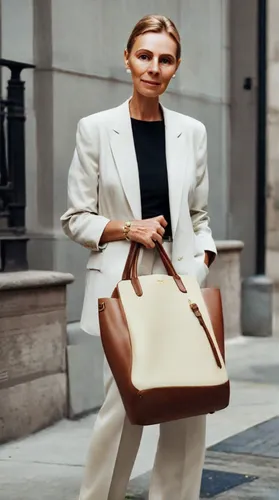 woman in menswear,briefcase,businesswoman,birkin bag,menswear for women,business woman,attache case,white-collar worker,business bag,leather suitcase,kelly bag,woman walking,laptop bag,blue jasmine,purse,business girl,blonde woman reading a newspaper,handbag,yellow purse,breakfast at tiffany's