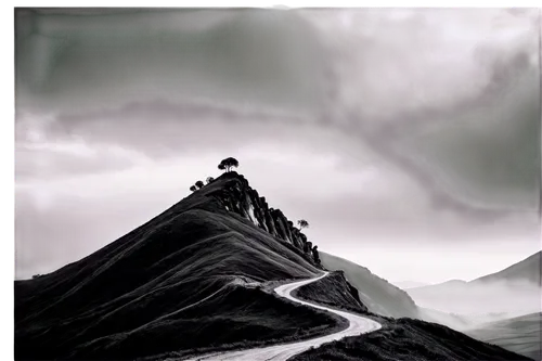 Mountainous landscape, black and white, misty atmosphere, rugged rocks, rolling hills, winding roads, solitary tree, dramatic clouds, low-angle shot, panoramic view, high contrast, detailed texture, c