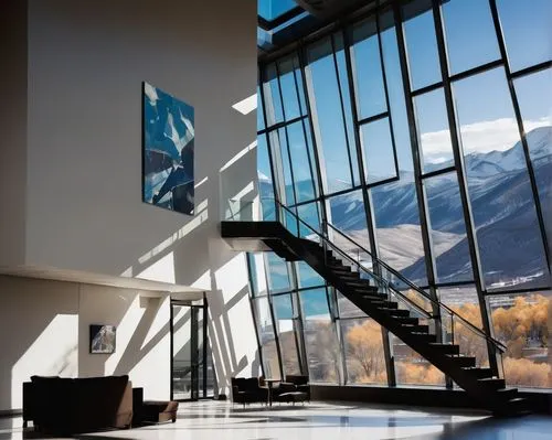 Denver Art Museum, modern architecture, unique geometric shape, titanium panels, dramatic angles, grand entrance, staircase, open atrium, natural light, brutalist style, graphic patterns, abstract sha