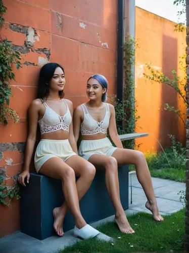 Girls in front of a beautiful wall,two girls are sitting next to each other near an orange wall,serebro,reinas,quinceaneras,modelos,chicanas,hudgens,Photography,Documentary Photography,Documentary Pho