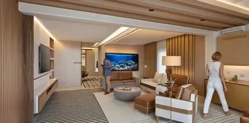 fish tank sunk inside the wall flush to surface with coral reef and many fishes,a white and brown room with a man standing in front of a fish tank,stateroom,modern room,luxury bathroom,guestrooms,hote