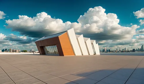 a picture of a building on the beach in front of the city,proxima,piramal,prodromal,airdromes,croma,promontory