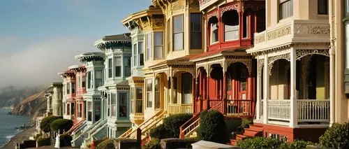 San Francisco architecture, Victorian houses, steep roofs, ornate facades, colorful stucco walls, bay windows, turrets, Gothic Revival style, intricate details, foggy atmosphere, misty morning, Alcatr