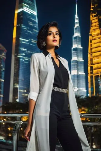 Modern designer, Sonali Bhagwati, standing confidently, one hand on hip, holding a large portfolio, stylishly dressed in a white shirt, black trousers, high heels, elegant silver jewelry, sleek short 