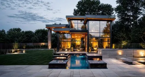 modern home with garden, indoor swimming pool, at dusk,modern house,luxury home,pool house,beautiful home,modern architecture,luxury property,summer house,cubic house,crib,mansion,luxury home interior