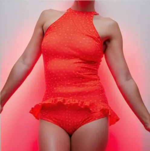 red colour ,a woman with an orange halter top and skirt posing for the camera,orange,shapewear,fluoro,bright orange,zentai,salmon pink,Photography,Artistic Photography,Artistic Photography 09