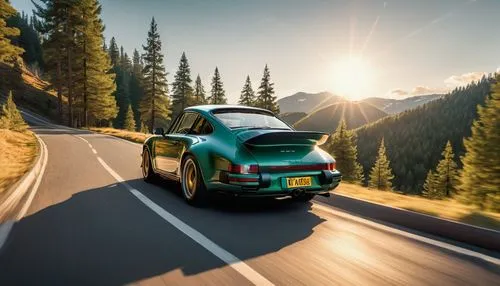 a porsche far away driving down a mountain windy road. Car from the back in line with the camera and the road. The sun rising in front of the car. Lots of pine trees and green. Morning light. in the s