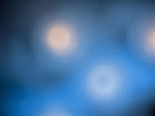 blurry night background with lights that appear to be made of cells,bokeh lights,bokeh,bokeh pattern,blue spheres,square bokeh,background bokeh