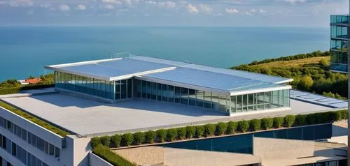 a building with curtain wall and aluminum cladding with terrace ,snohetta,phototherapeutics,bjarke,batumi,glass facade,epfl,glass building,vab,event venue,sochi,skolkovo,penthouses,glass facades,ecthr