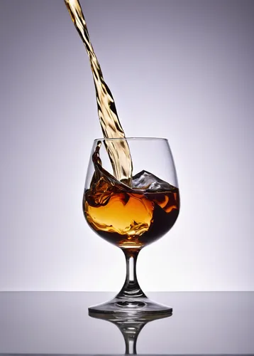 Write a description of a smooth bourbon whiskey flowing into a glass.,whiskey glass,blended malt whisky,old fashioned glass,single malt scotch whisky,sazerac,single malt whisky,cocktail glass,decanter